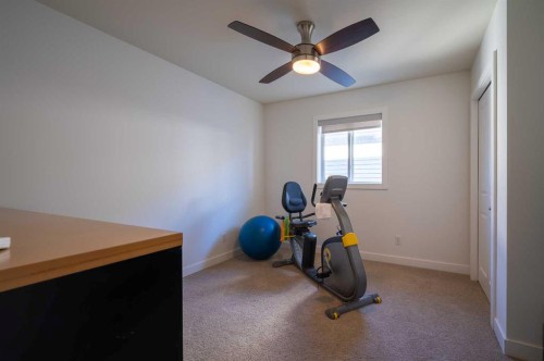 82 Chapalina Close Se, Calgary, AB - Indoor Photo Showing Gym Room