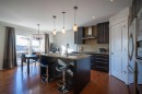 82 Chapalina Close Se, Calgary, AB  - Indoor Photo Showing Kitchen With Upgraded Kitchen 