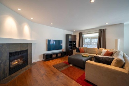 82 Chapalina Close Se, Calgary, AB - Indoor Photo Showing Living Room With Fireplace