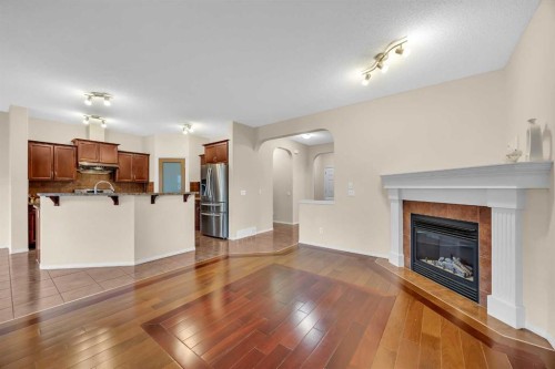 109 Bridlerange Place Sw, Calgary, AB - Indoor Photo Showing Other Room With Fireplace