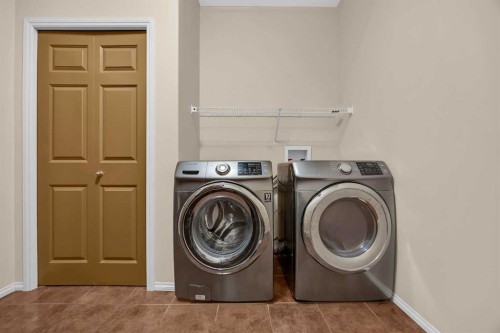 109 Bridlerange Place Sw, Calgary, AB - Indoor Photo Showing Laundry Room