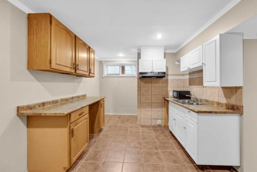109 Bridlerange Place Sw, Calgary, AB - Indoor Photo Showing Kitchen