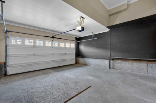 109 Bridlerange Place Sw, Calgary, AB - Indoor Photo Showing Garage