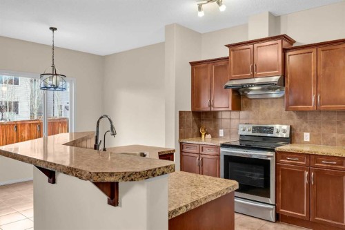 109 Bridlerange Place Sw, Calgary, AB - Indoor Photo Showing Kitchen With Upgraded Kitchen