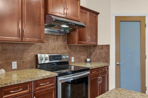 109 Bridlerange Place Sw, Calgary, AB - Indoor Photo Showing Kitchen
