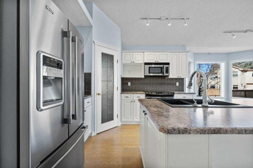 58 Chaparral Close Se, Calgary, AB - Indoor Photo Showing Kitchen With Double Sink With Upgraded Kitchen