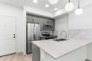 #217-140 Mahogany Street Se, Calgary, AB  - Indoor Photo Showing Kitchen With Stainless Steel Kitchen With Double Sink With Upgraded Kitchen 
