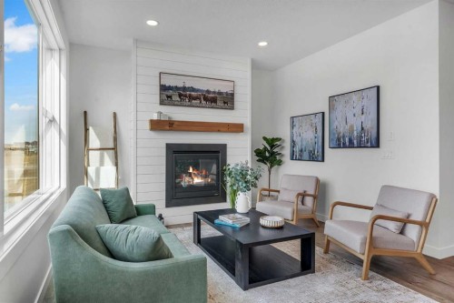 303 Kinniburgh Loop, Chestermere, AB - Indoor Photo Showing Living Room With Fireplace