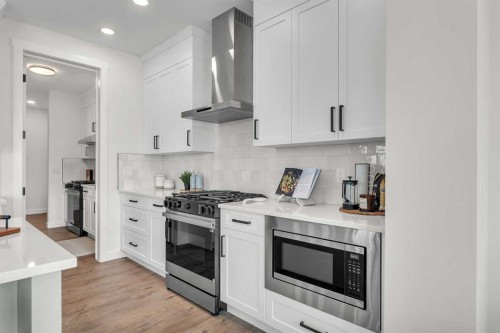 303 Kinniburgh Loop, Chestermere, AB - Indoor Photo Showing Kitchen With Upgraded Kitchen
