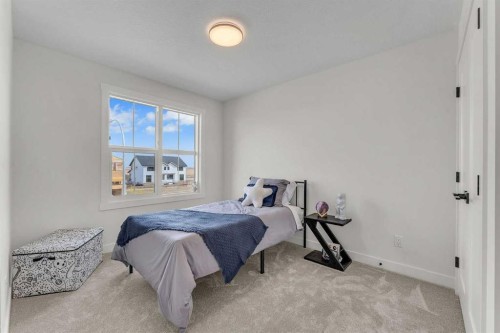 303 Kinniburgh Loop, Chestermere, AB - Indoor Photo Showing Bedroom