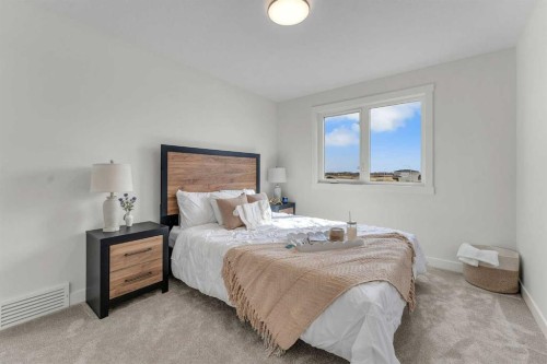 303 Kinniburgh Loop, Chestermere, AB - Indoor Photo Showing Bedroom