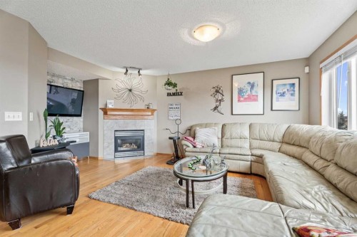 51 Westfall Crescent, Okotoks, AB - Indoor Photo Showing Living Room With Fireplace