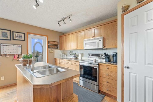 51 Westfall Crescent, Okotoks, AB - Indoor Photo Showing Kitchen With Double Sink