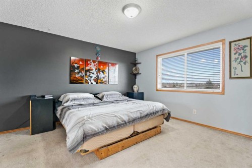 51 Westfall Crescent, Okotoks, AB - Indoor Photo Showing Bedroom