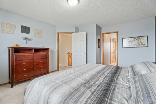 51 Westfall Crescent, Okotoks, AB - Indoor Photo Showing Bedroom