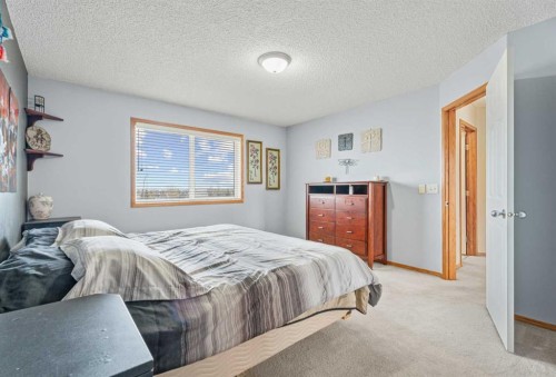 51 Westfall Crescent, Okotoks, AB - Indoor Photo Showing Bedroom