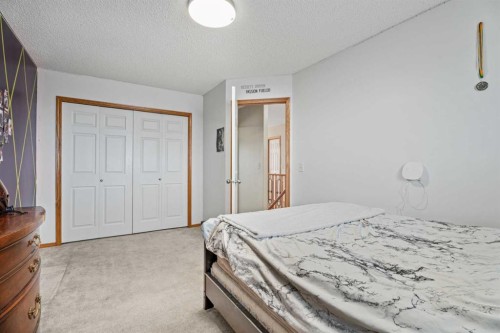 51 Westfall Crescent, Okotoks, AB - Indoor Photo Showing Bedroom