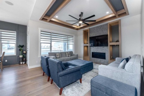 66 Waterford Road, Chestermere, AB - Indoor Photo Showing Living Room With Fireplace