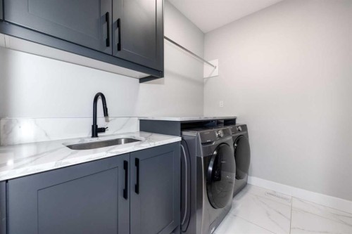 66 Waterford Road, Chestermere, AB - Indoor Photo Showing Laundry Room