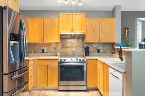 204 Hidden Spring Green Nw, Calgary, AB - Indoor Photo Showing Kitchen