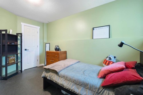 204 Hidden Spring Green Nw, Calgary, AB - Indoor Photo Showing Bedroom