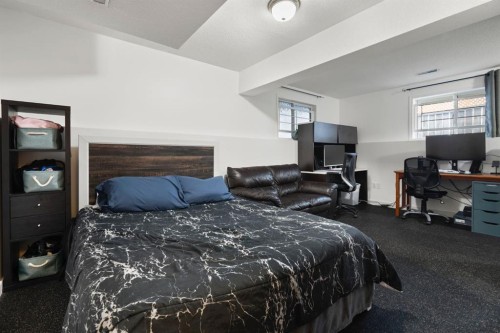 204 Hidden Spring Green Nw, Calgary, AB - Indoor Photo Showing Bedroom