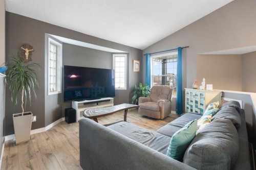 204 Hidden Spring Green Nw, Calgary, AB - Indoor Photo Showing Living Room