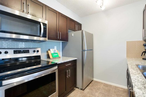 2316-81 Legacy Boulevard Se, Calgary, AB - Indoor Photo Showing Kitchen With Stainless Steel Kitchen With Double Sink