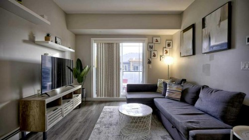 410-150 Auburn Meadows Manor Se, Calgary, AB - Indoor Photo Showing Living Room
