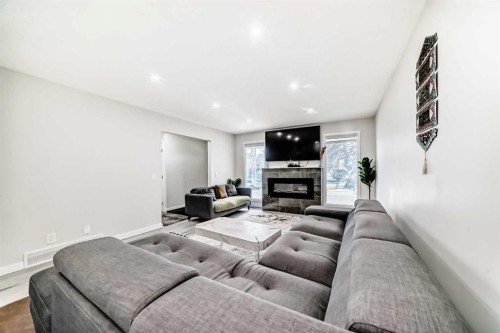 6712 23 Avenue Ne, Calgary, AB - Indoor Photo Showing Living Room With Fireplace
