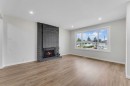 1271 Penedo Crescent Se, Calgary, AB  - Indoor Photo Showing Living Room With Fireplace 