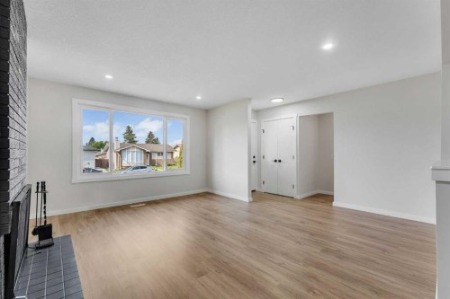 1271 Penedo Crescent Se, Calgary, AB - Indoor With Fireplace