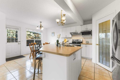 26 Arbour Butte Way Nw, Calgary, AB - Indoor Photo Showing Kitchen With Double Sink