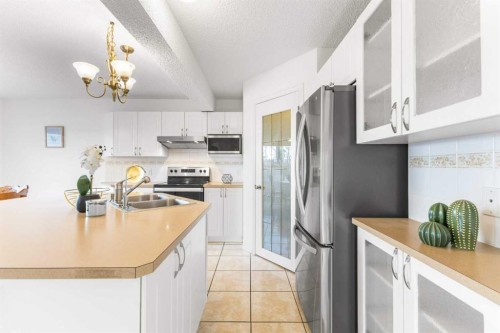26 Arbour Butte Way Nw, Calgary, AB - Indoor Photo Showing Kitchen With Double Sink