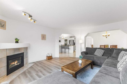 26 Arbour Butte Way Nw, Calgary, AB - Indoor Photo Showing Living Room With Fireplace