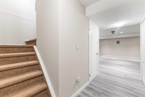 26 Arbour Butte Way Nw, Calgary, AB - Indoor Photo Showing Other Room