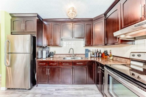 6411 26 Avenue Ne, Calgary, AB - Indoor Photo Showing Kitchen With Stainless Steel Kitchen With Double Sink