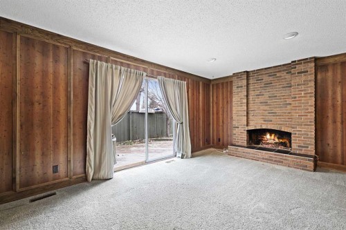 27 Sunmount Crescent Se, Calgary, AB - Indoor With Fireplace