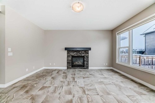 34 Cranbrook Hill Se, Calgary, AB - Indoor Photo Showing Living Room With Fireplace
