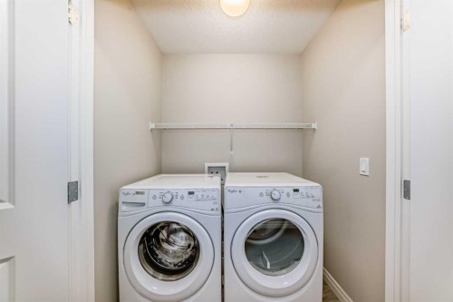 34 Cranbrook Hill Se, Calgary, AB - Indoor Photo Showing Laundry Room