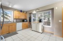 90 Patina Rise Sw, Calgary, AB  - Indoor Photo Showing Kitchen With Double Sink 