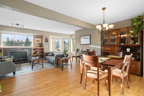 90 Patina Rise Sw, Calgary, AB - Indoor Photo Showing Dining Room With Fireplace