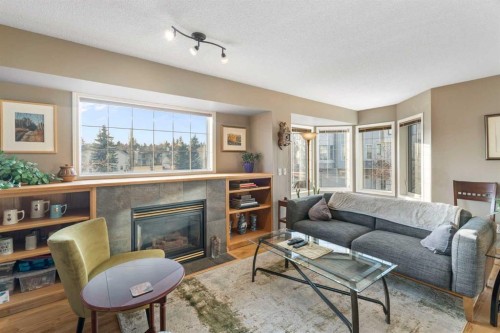 90 Patina Rise Sw, Calgary, AB - Indoor Photo Showing Living Room With Fireplace