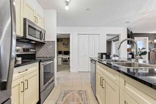 2212-81 Legacy Boulevard Se, Calgary, AB - Indoor Photo Showing Kitchen With Stainless Steel Kitchen With Double Sink With Upgraded Kitchen