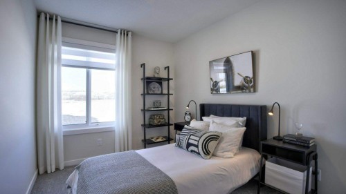 754 Wolf Willow Boulevard Se, Calgary, AB - Indoor Photo Showing Bedroom