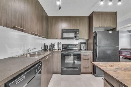 232-300 Marina Drive, Chestermere, AB - Indoor Photo Showing Kitchen With Double Sink