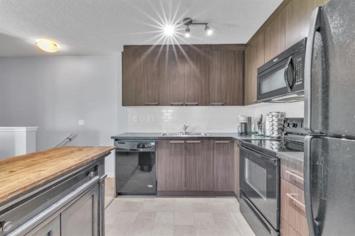 232-300 Marina Drive, Chestermere, AB - Indoor Photo Showing Kitchen With Double Sink