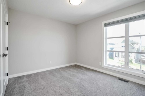 28 Willow Street, Cochrane, AB - Indoor Photo Showing Other Room