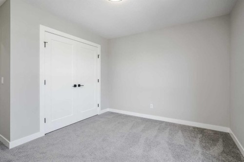 28 Willow Street, Cochrane, AB - Indoor Photo Showing Other Room