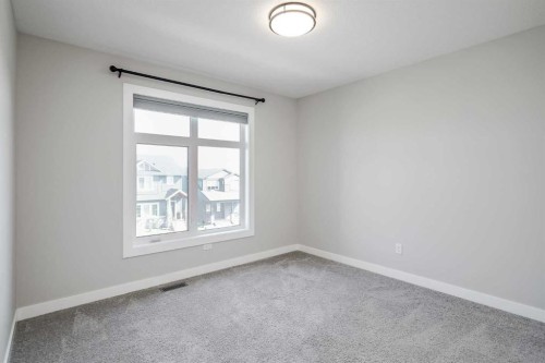 28 Willow Street, Cochrane, AB - Indoor Photo Showing Other Room